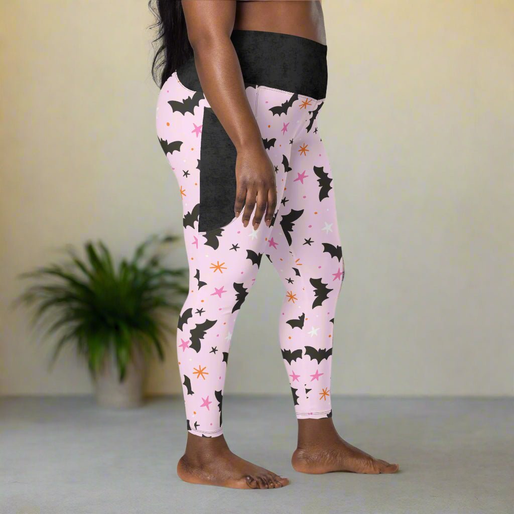 Leggings with black bat pattern on a pink background
