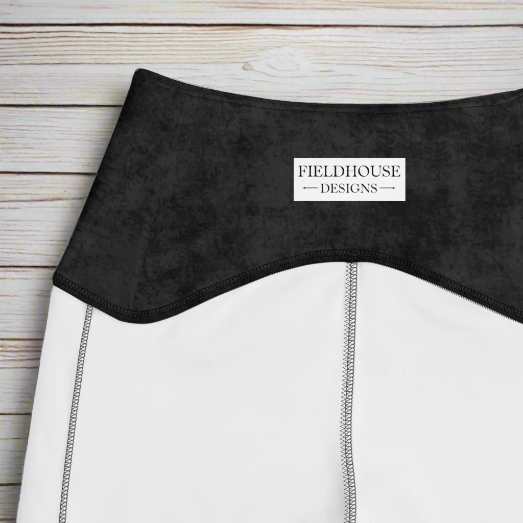 Close-up of a black waistband with 'Fieldhouse Designs' label.