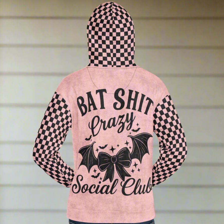 Pink hoodie with black checkered sleeves and text design on a white background