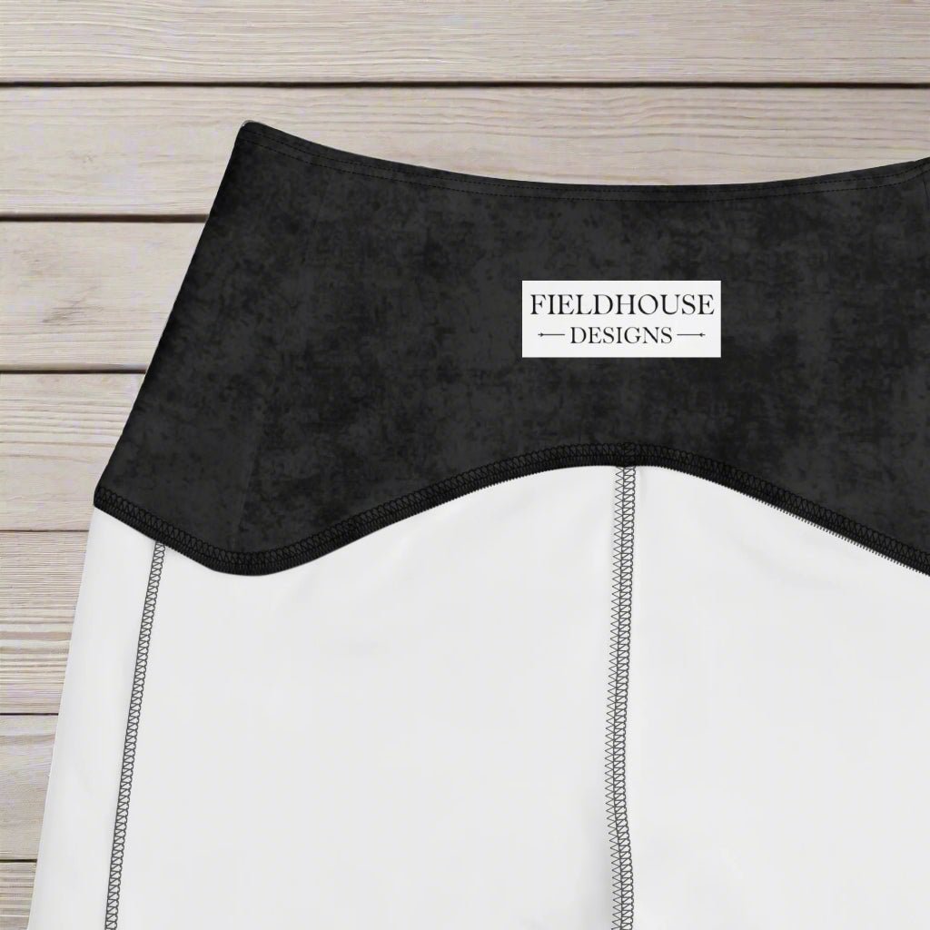 Close-up of a black waistband with 'Fieldhouse Designs' label.