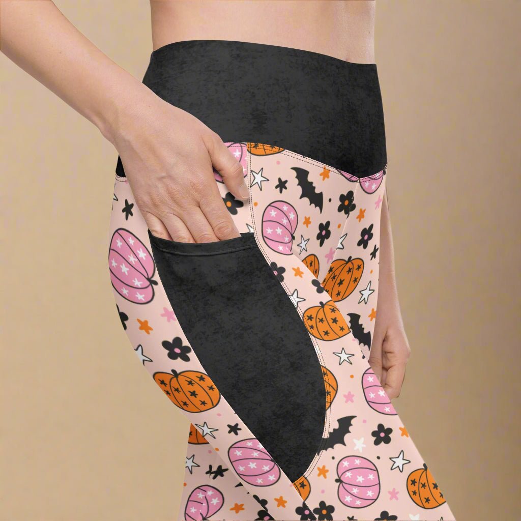 Leggings with Halloween pattern and black pocket on a beige background