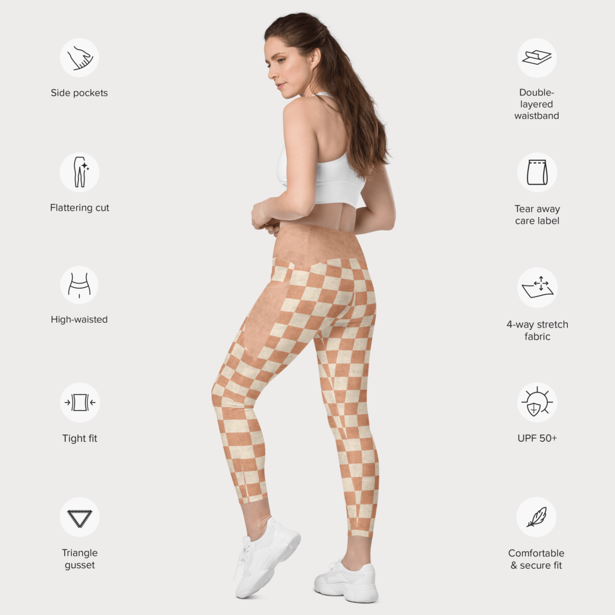 Woman wearing checkered leggings with feature icons on a white background