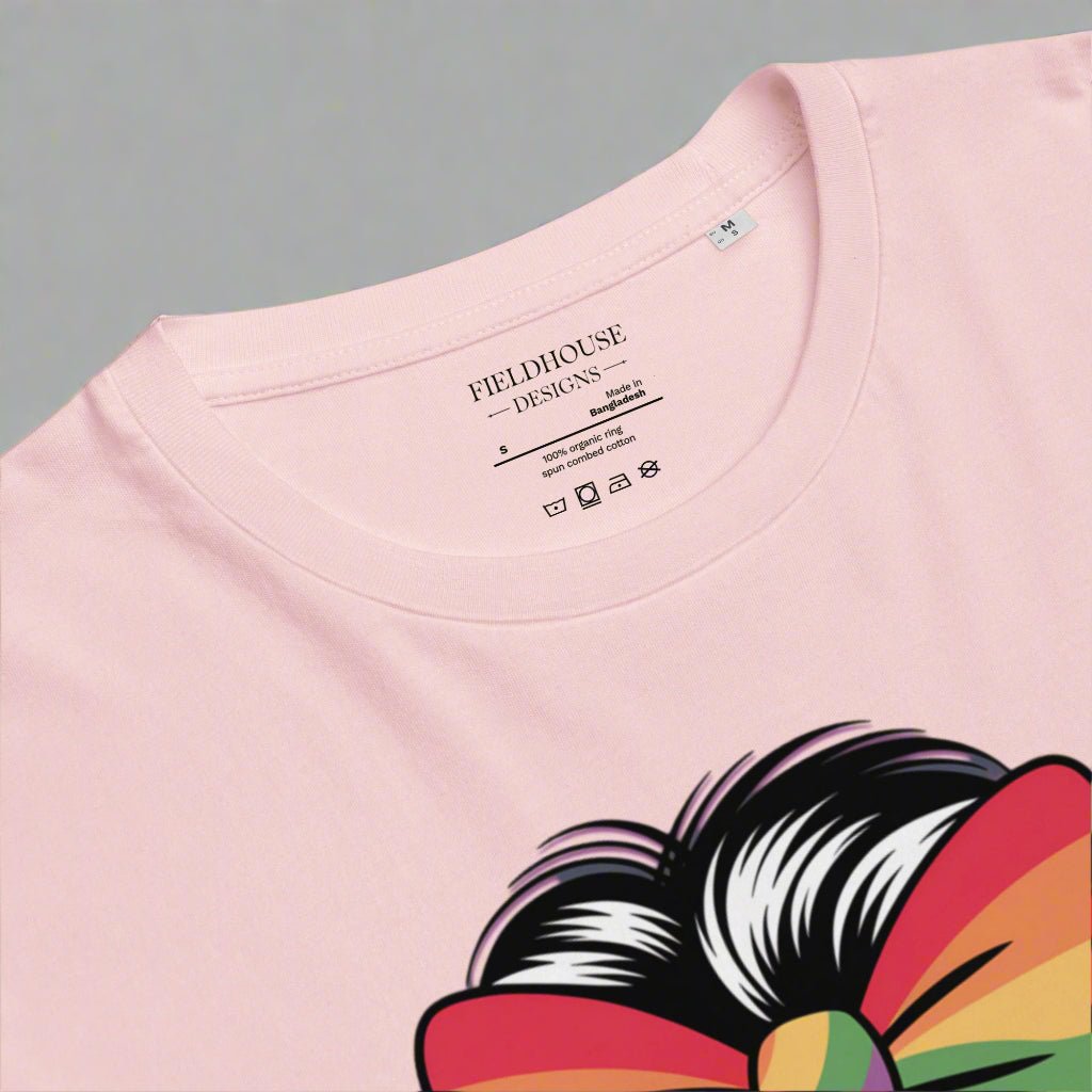 Pink t-shirt with colorful design and 'Fieldhouse Designs' label on a white background