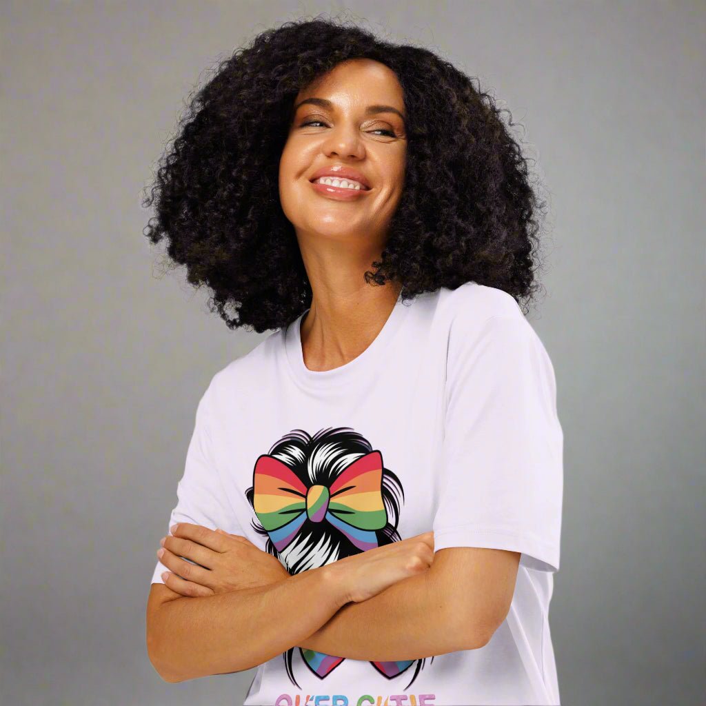 Woman wearing a white t-shirt with a colorful graphic design on a white background