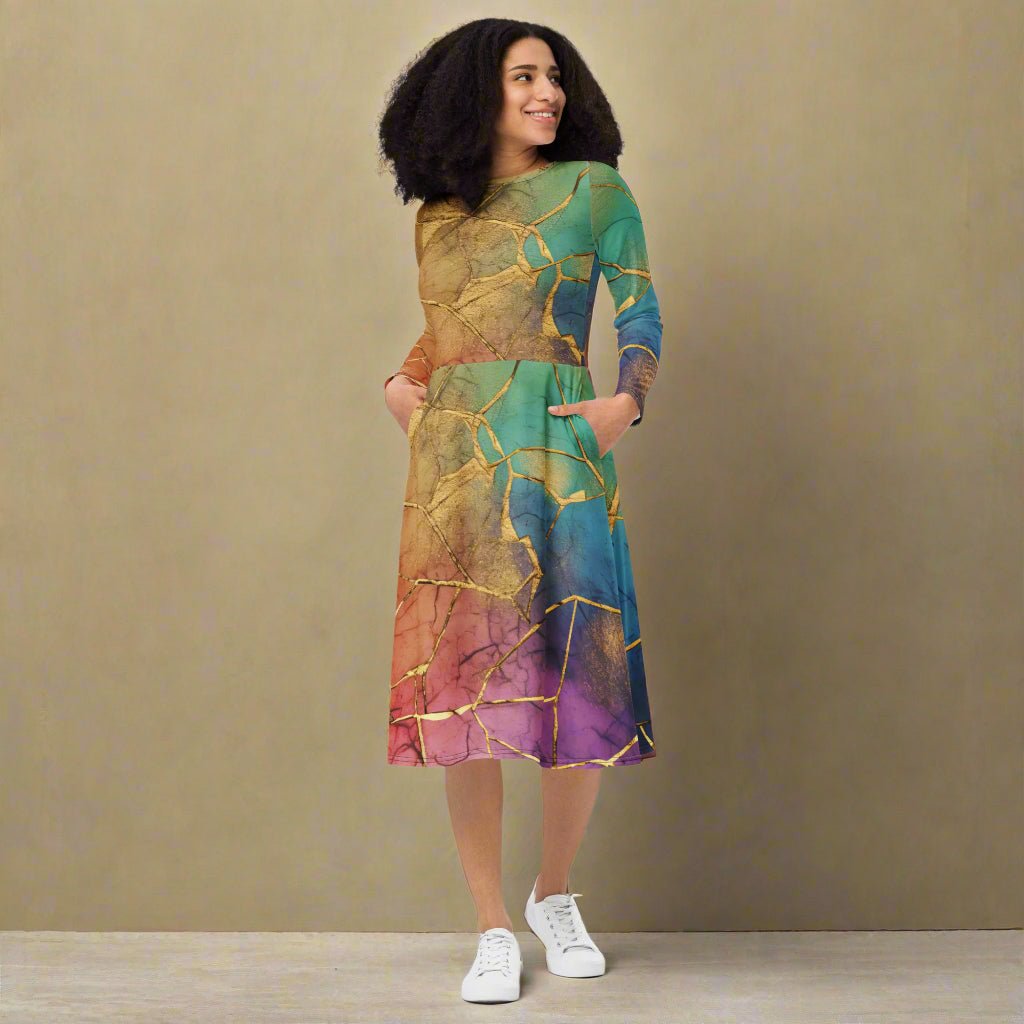 Woman wearing a rainbow dress with a neutral background