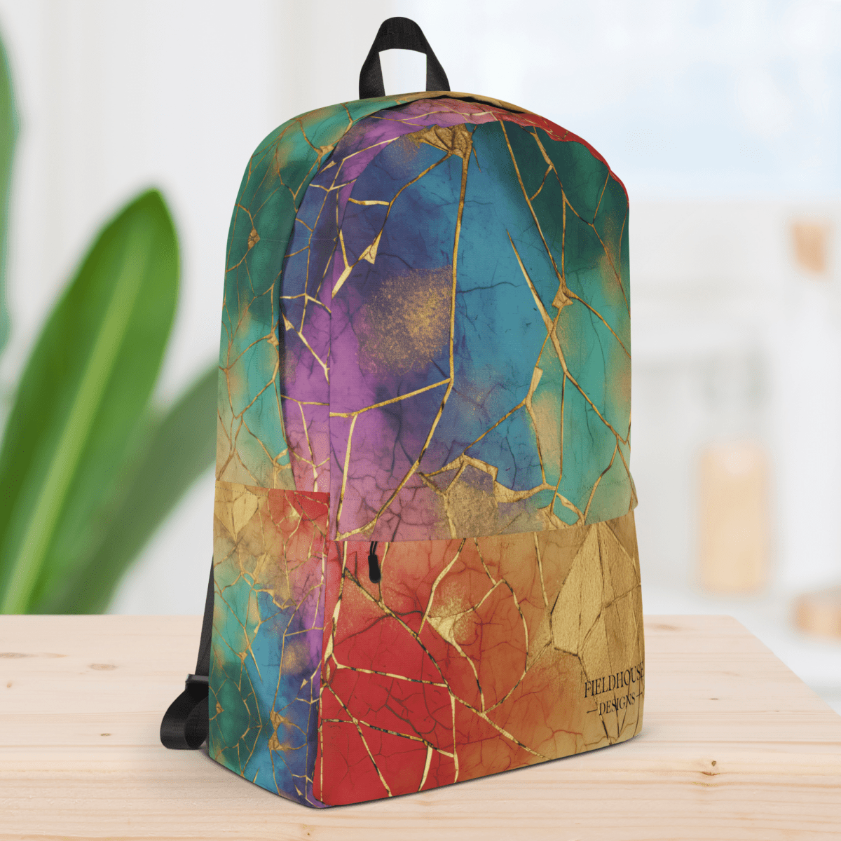 Colorful backpack with a cracked design on a wooden surface.