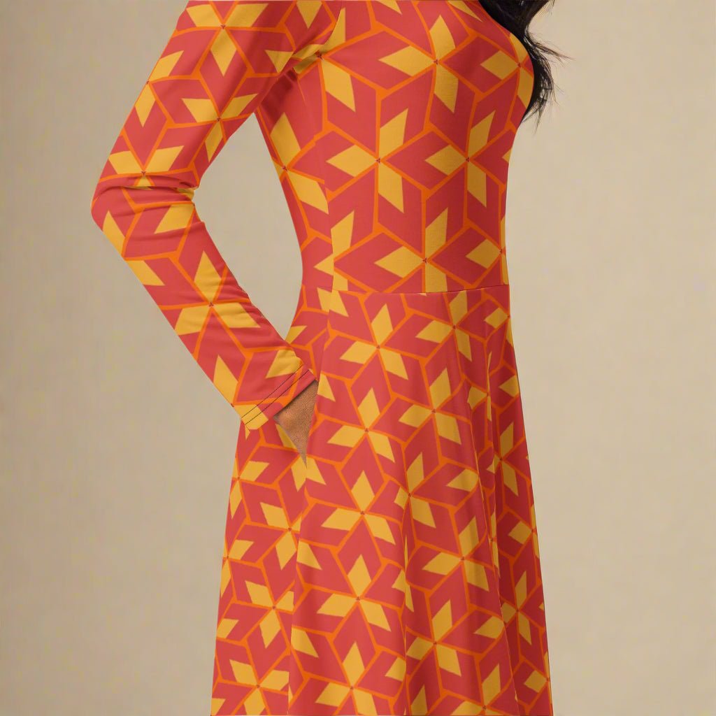 Red and yellow geometric patterned dress on a plain background