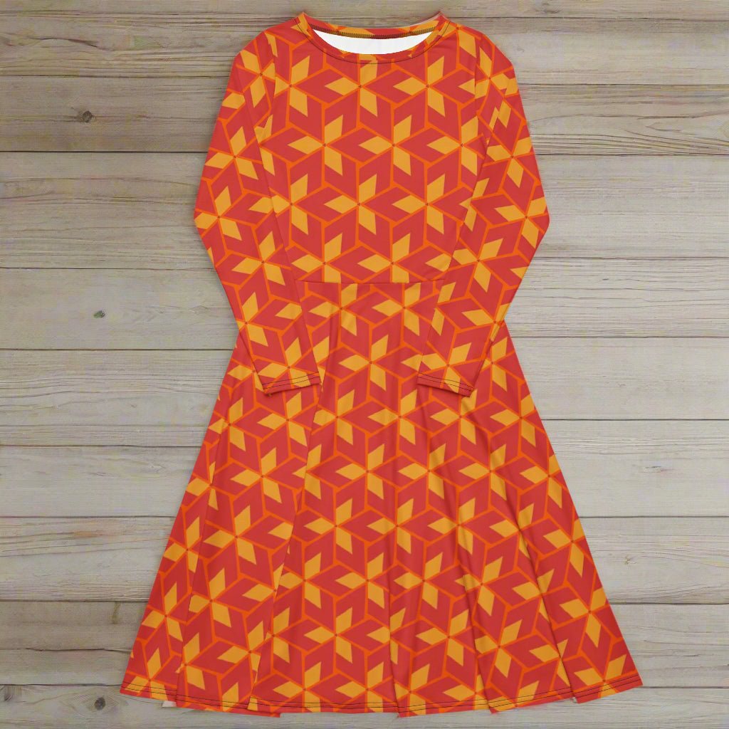 Orange and yellow geometric patterned dress on a wooden surface