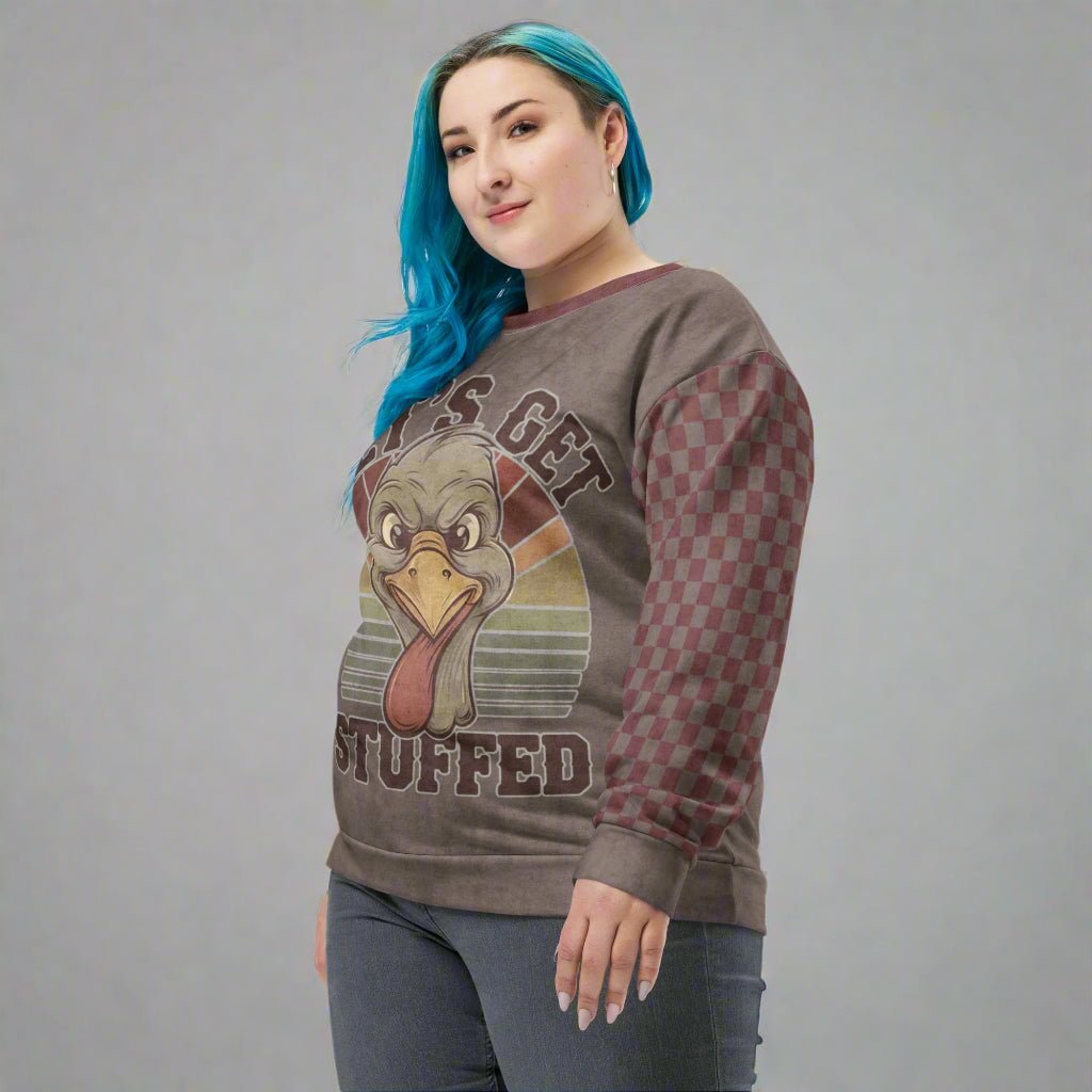 Person wearing a sweater with a turkey graphic and text on a neutral background