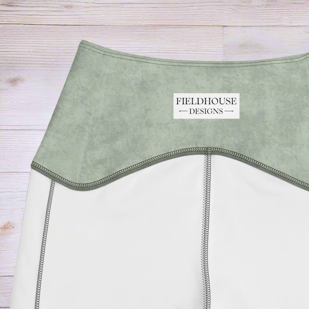 Close-up of a garment with 'Fieldhouse Designs' label on a white background