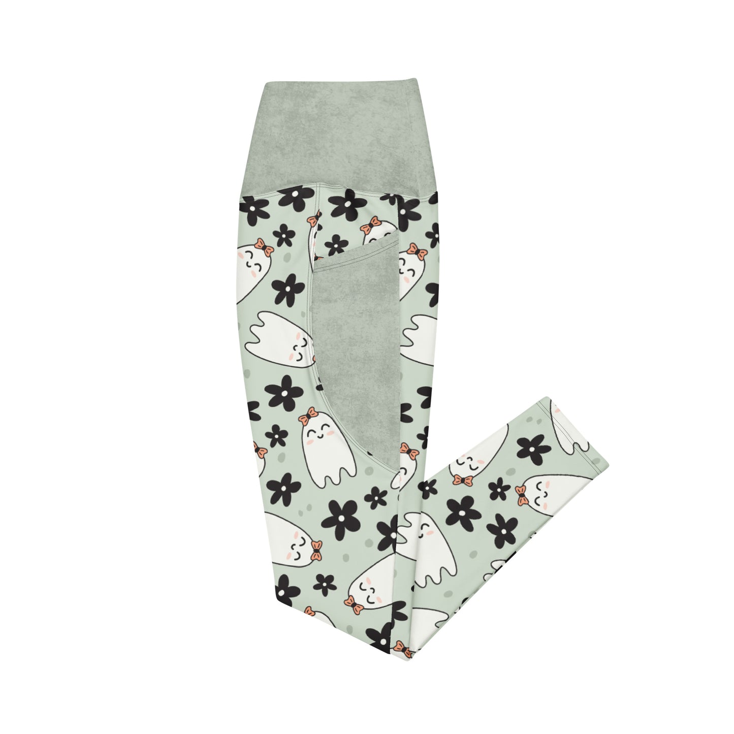 Folded leggings with ghost and flower pattern on a wooden surface