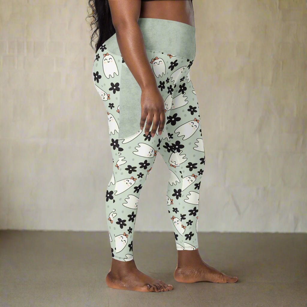 Leggings with ghost and flower pattern worn by a person on a beige background