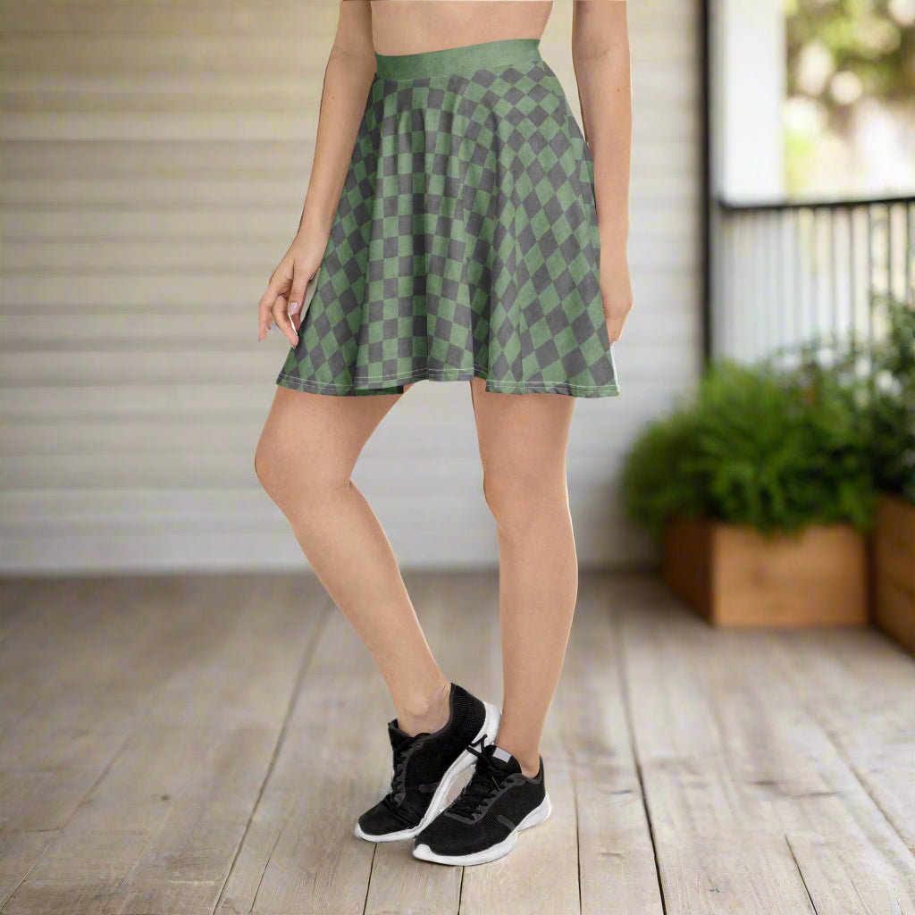 Person wearing a green checkered skirt standing on a wooden floor.