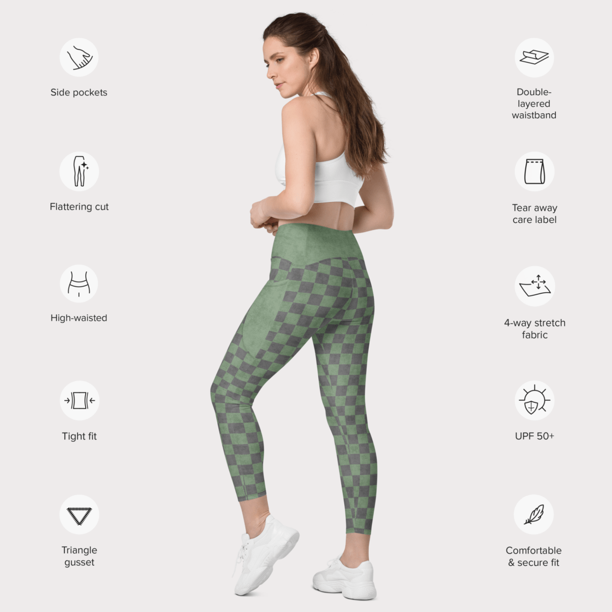 Woman wearing green checkered leggings with feature icons on a white background