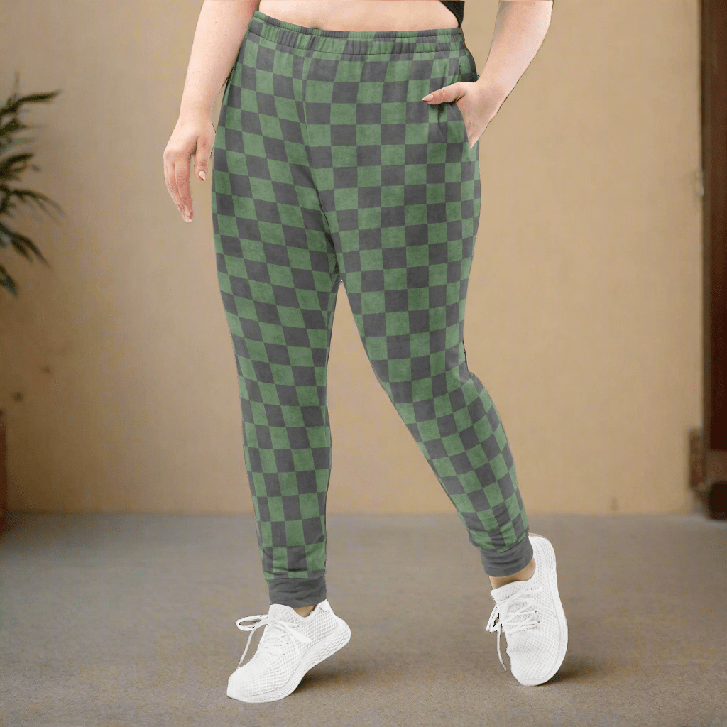 Green and gray checkered pants worn by a person on a neutral background