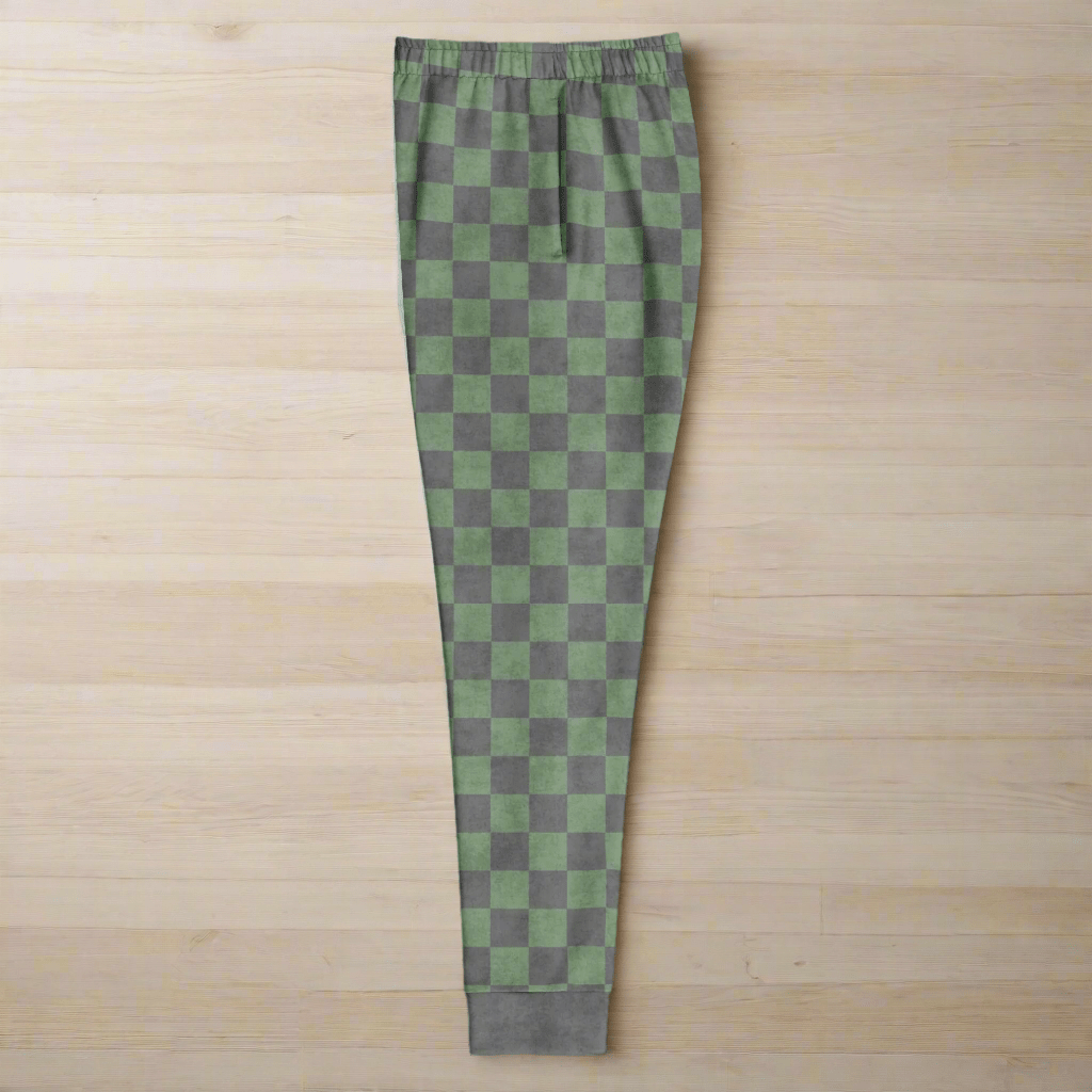 Green and gray checkered pants on a wood background