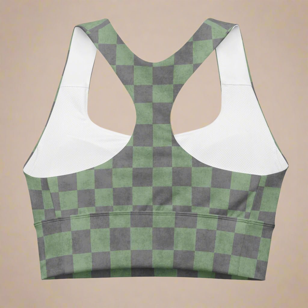 Green and gray checkered sports bra with on a beige background