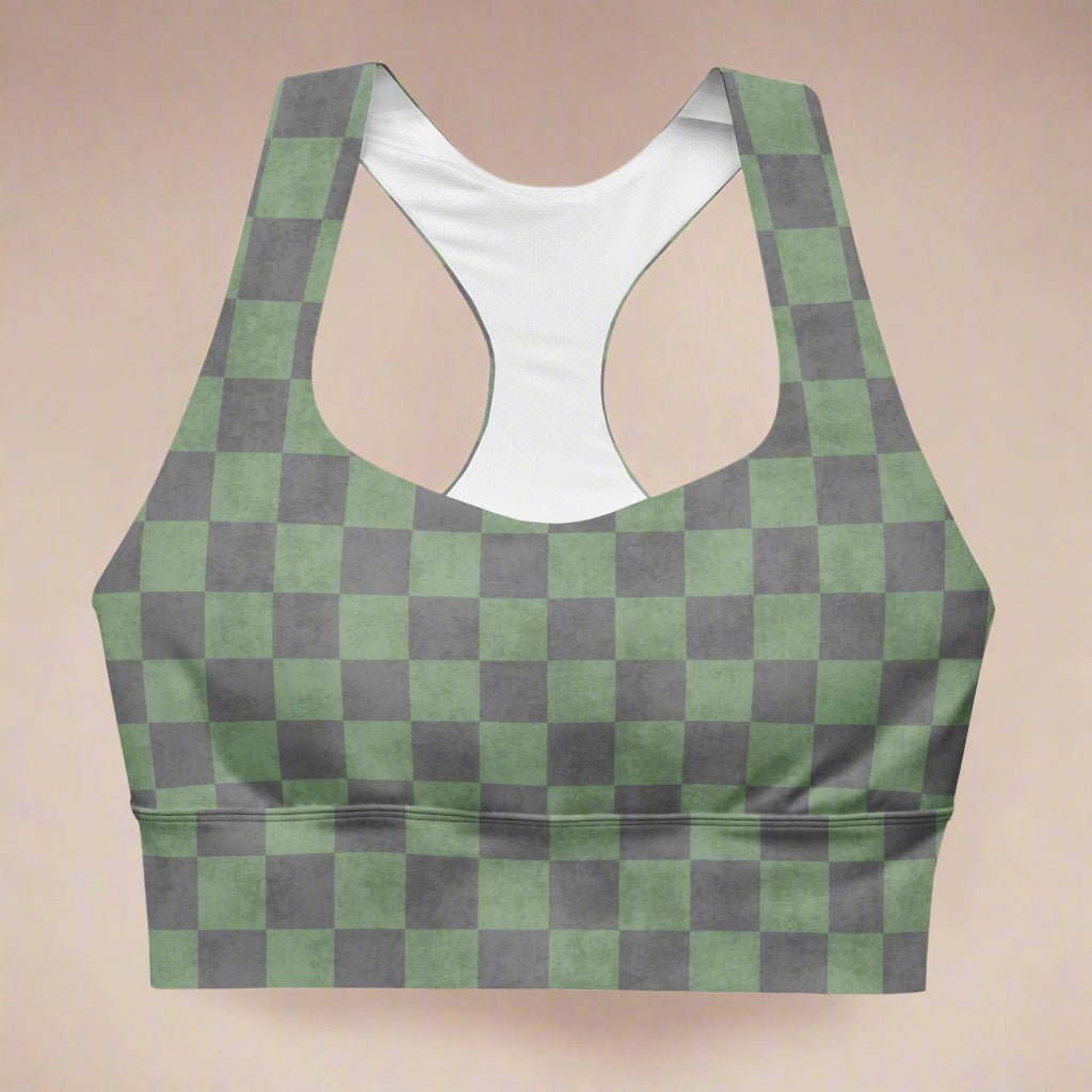 Green and gray checkered sports bra on a beige background