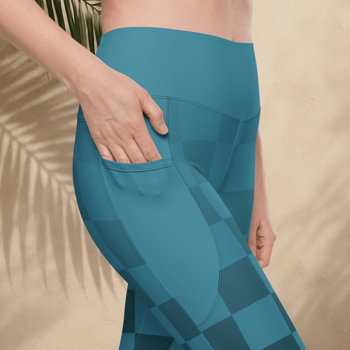 blue leggings with checker pattern worn by a person on a beige background