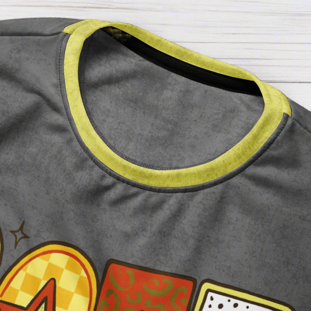 Gray sleeveless shirt with colorful graphic design on a wood background