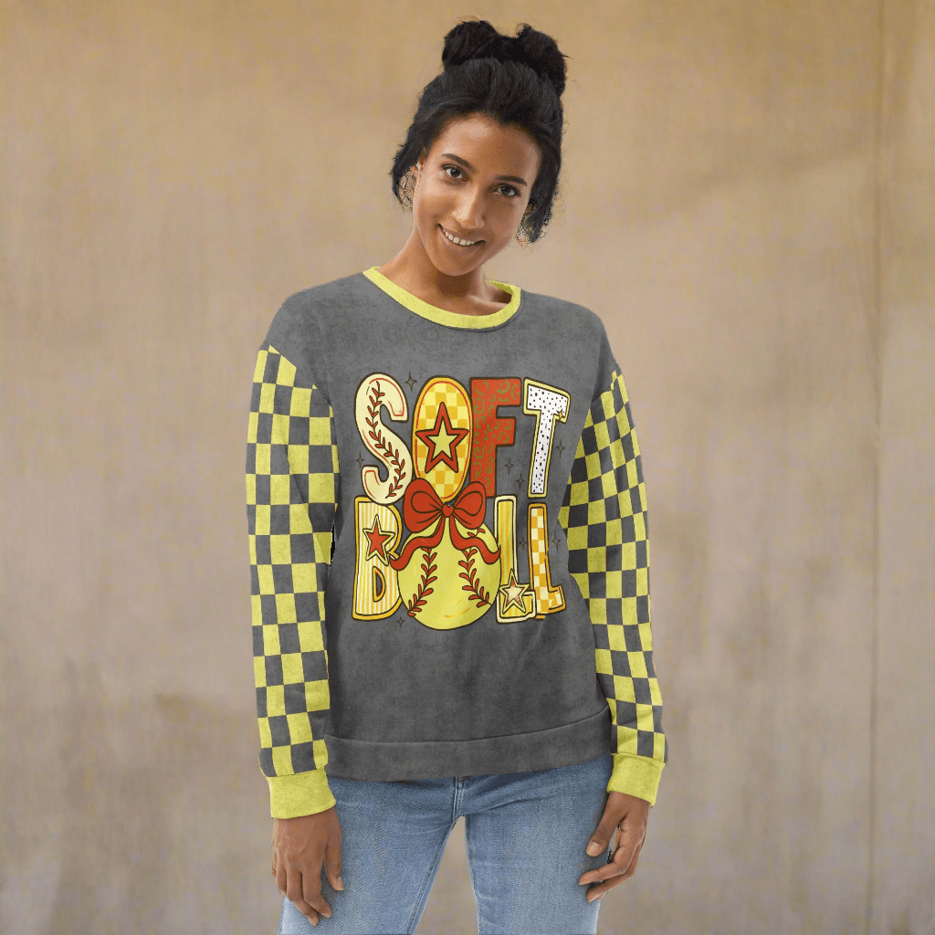 Woman wearing a gray sweatshirt with 'Softball' design on a neutral background