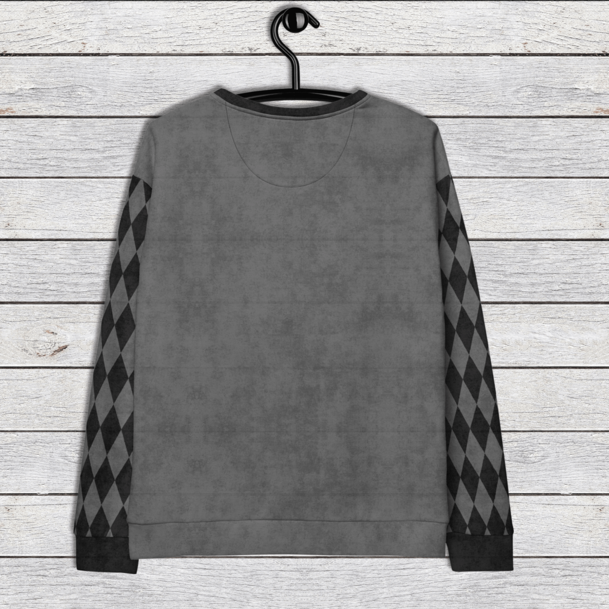Gray sweatshirt with argyle pattern sleeves on a wooden surface