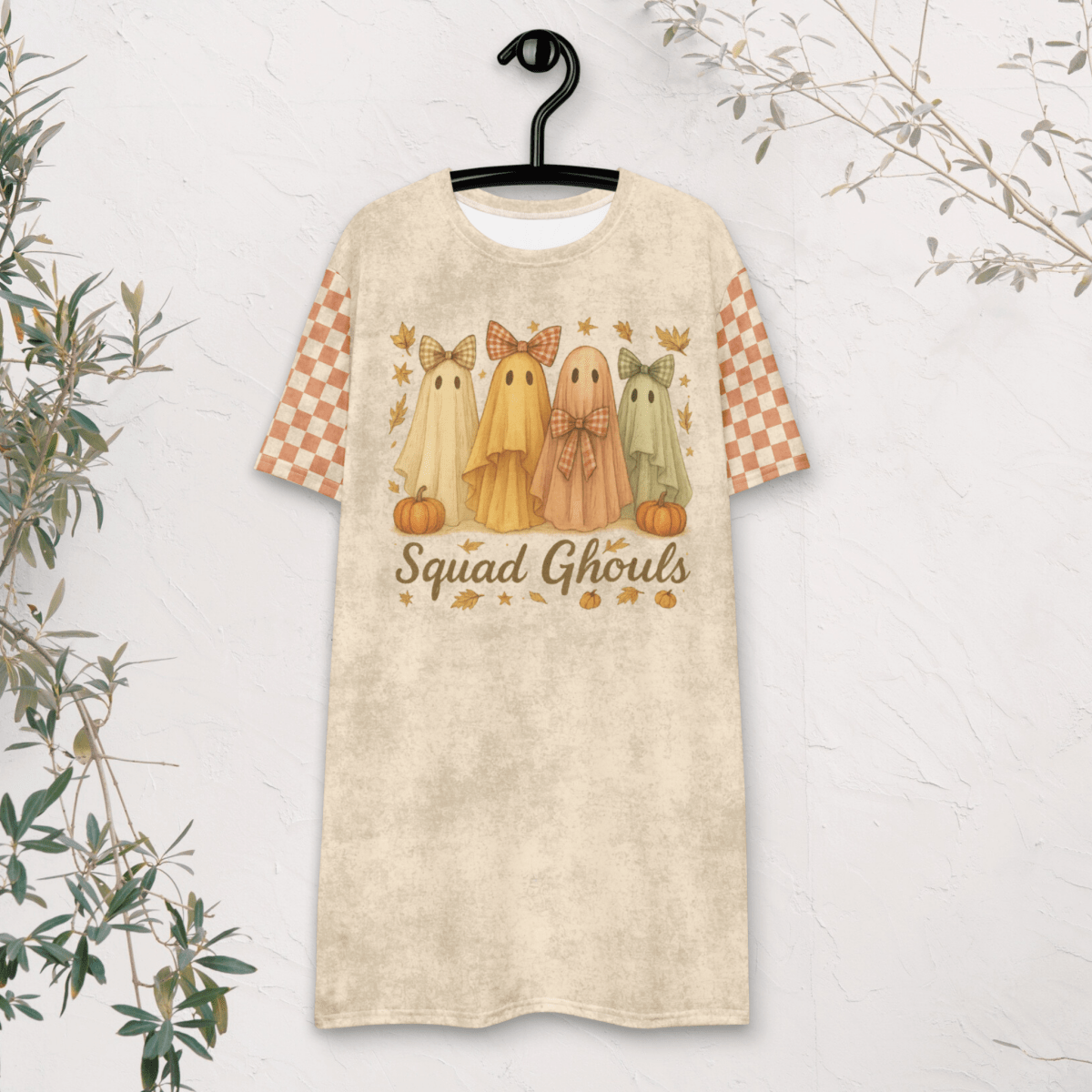 T-shirt with ghost design and 'Squad Ghouls' text on a hanger against a white background