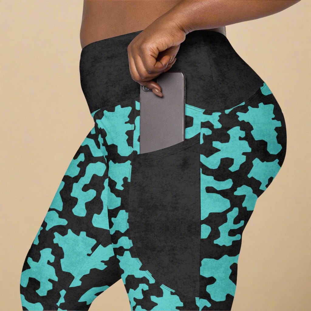 Turquoise and black camouflage leggings with a pocket.