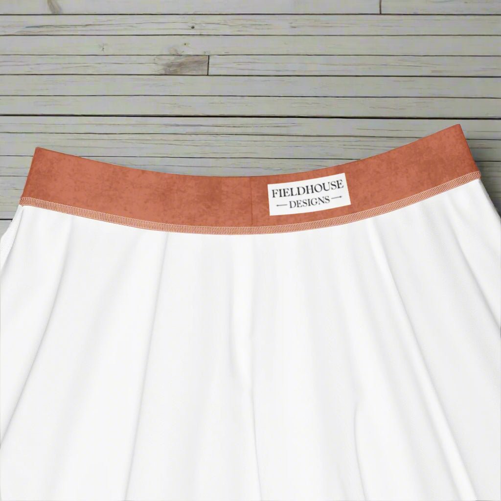 orange waistband featuring 'Fieldhouse Designs' branding on a white background.