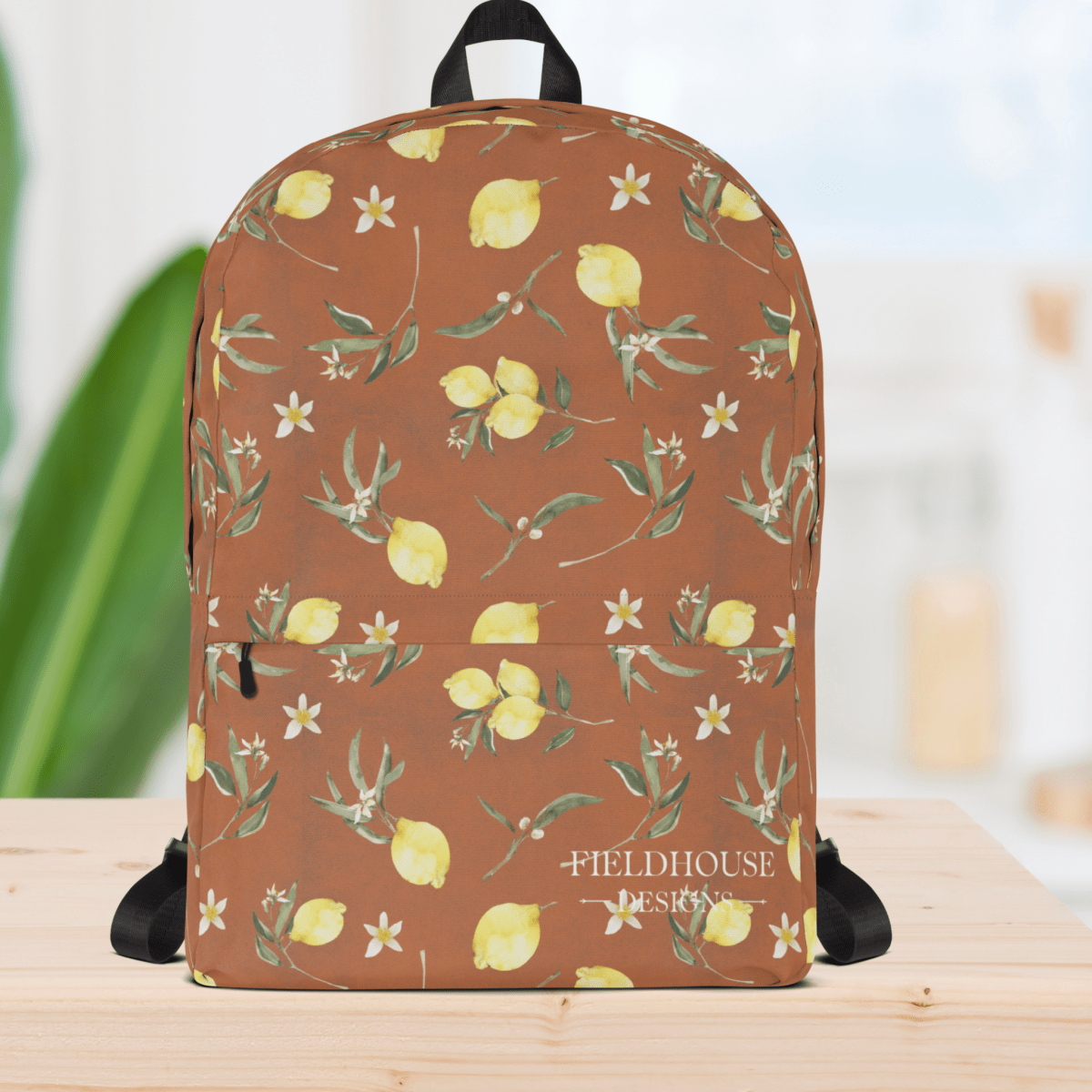 Backpack with lemon and floral pattern on a wooden surface