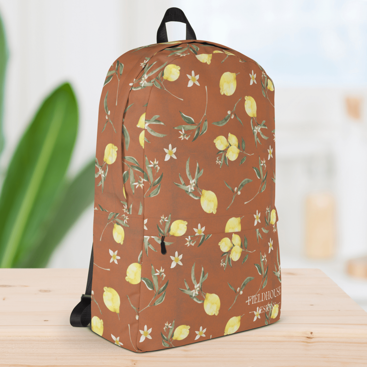 Backpack with lemon and floral pattern on a wooden surface