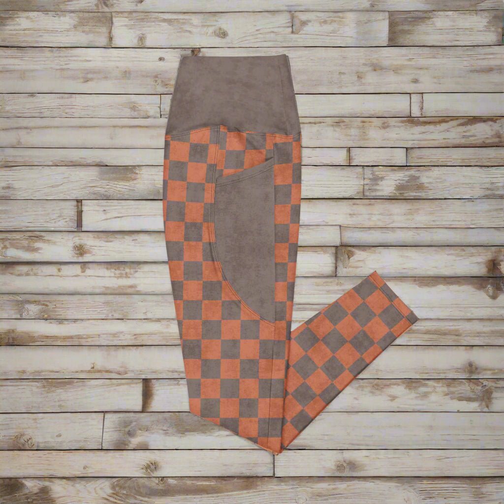 Checkered pants with brown and orange pattern on a white background