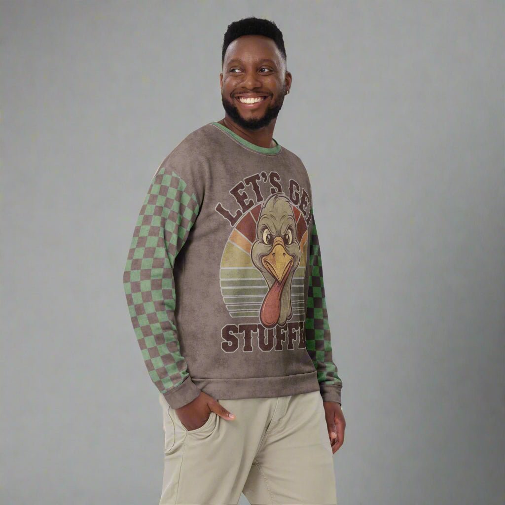 Man wearing a sweater with a turkey and text on a neutral background