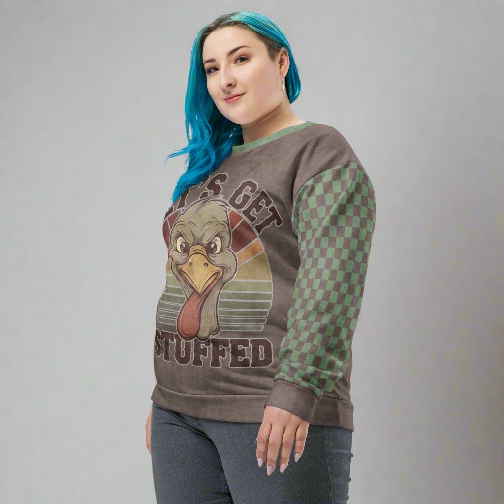 Person wearing a sweater with a turkey graphic and text on a neutral background