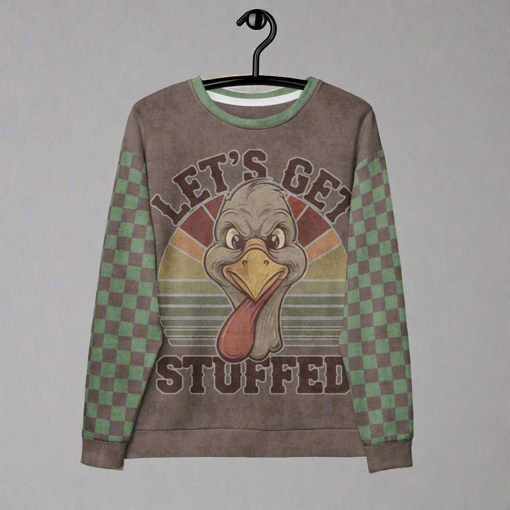 Sweatshirt with a cartoon turkey design and 'Let's Get Stuffed' text on a hanger.