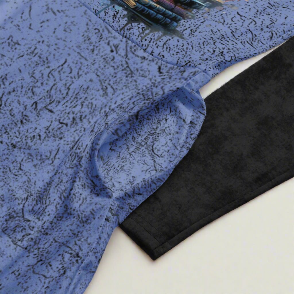 Blue textured dress with black sleeves on a white background