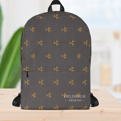 Gray backpack with yellow star pattern on a wooden surface