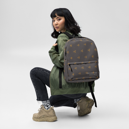 Person wearing a green jacket and carrying a gray backpack with star pattern on a white background