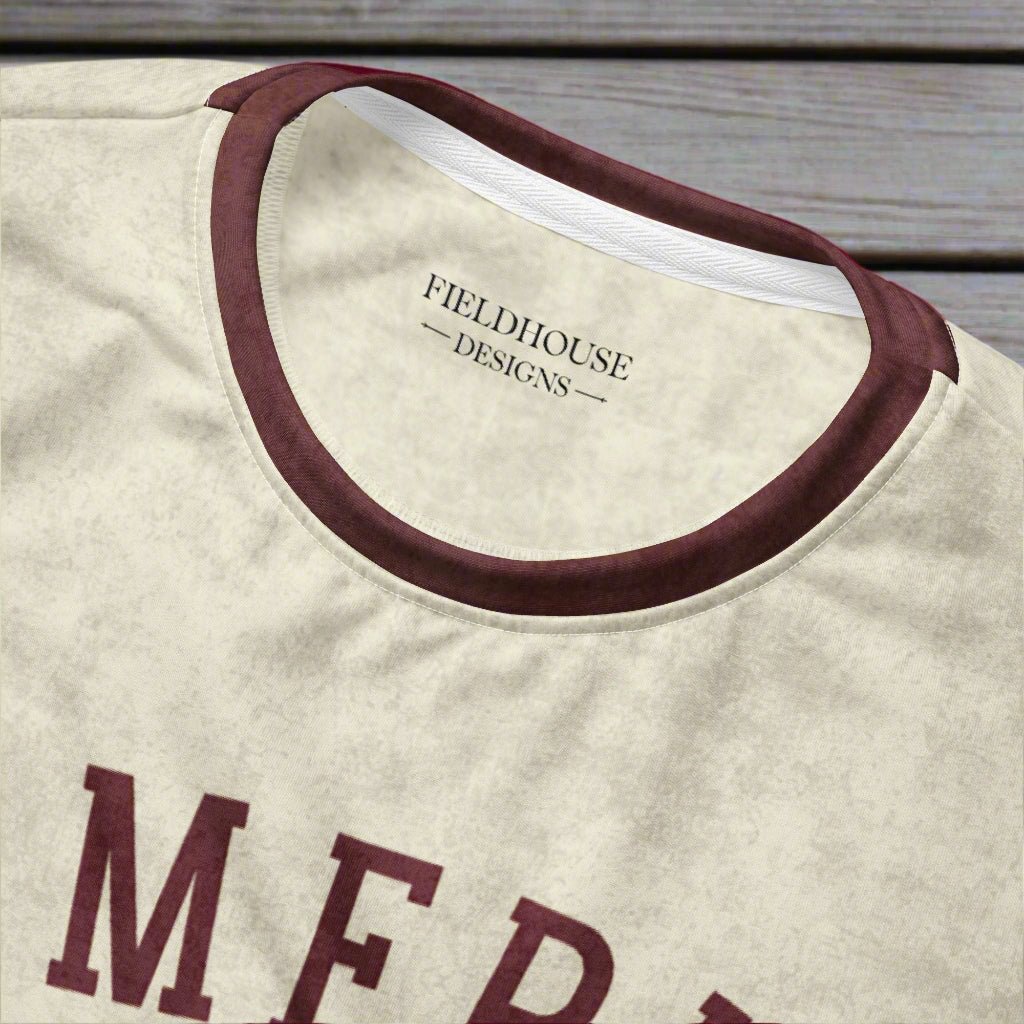Beige shirt with burgundy trim and 'Fieldhouse Designs' branding