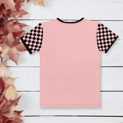 Pink t-shirt with black and pink checkered sleeves on a wooden surface with autumn leaves.