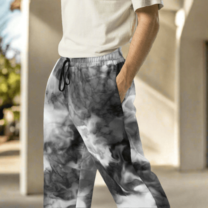 Person wearing gray tie-dye pants with a blurred background