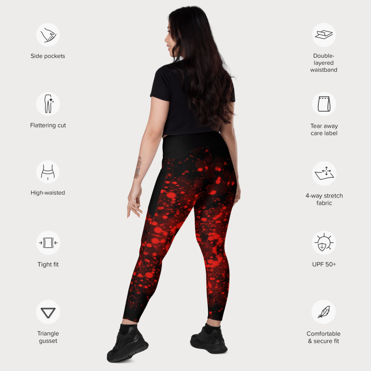 Woman wearing red and black patterned leggings with feature icons on a white background