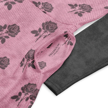 Pink fabric with charcoal rose pattern and black textured fabric underneath on a white background