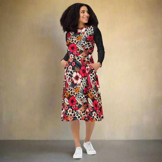 Woman wearing a colorful floral and animal print dress against a beige background