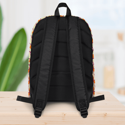 backside of a backpack with colorful pattern on a wooden surface