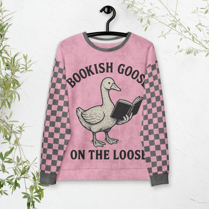 Pink sweater with a goose holding a book design and text 'Bookish Goose on the Loose' on a white background.
