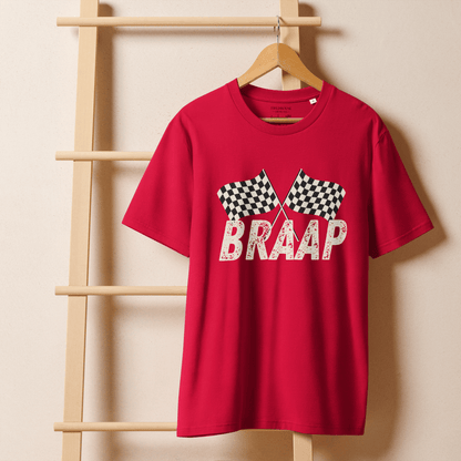 Red t-shirt with 'BRAAP' and checkered flags design on a wooden hanger against a beige wall.