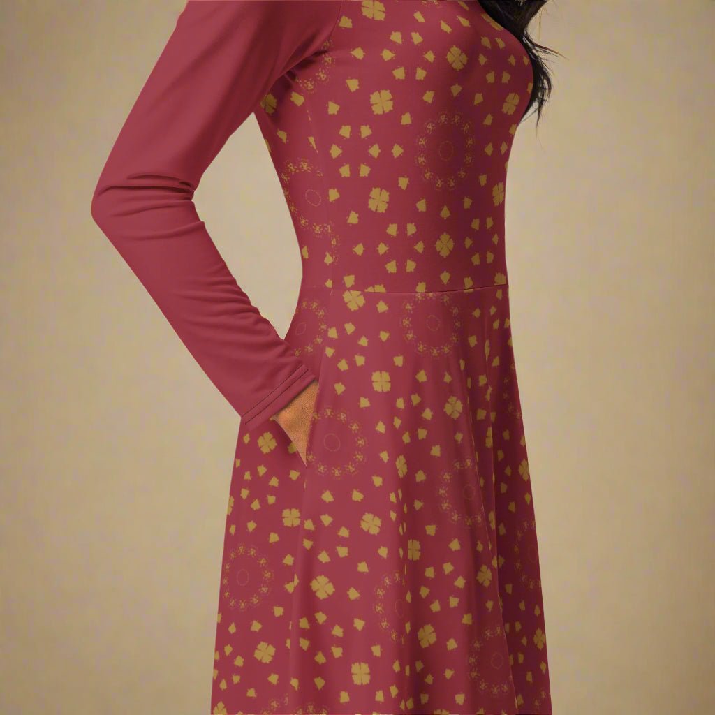 Burgundy dress with gold floral pattern on a neutral background