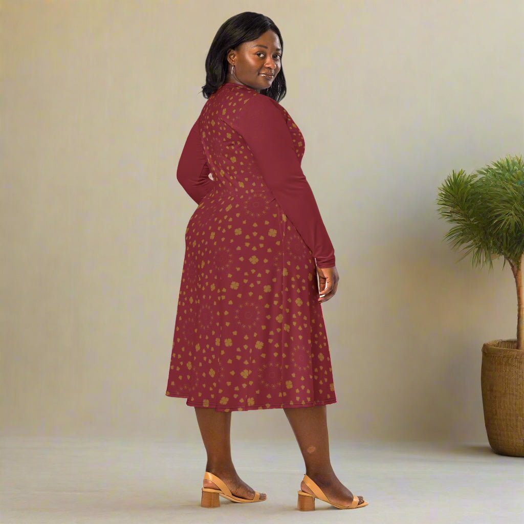 Woman wearing a burgundy dress with a subtle pattern on a neutral background