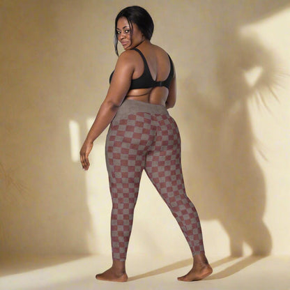 Woman wearing checkered leggings on a neutral background